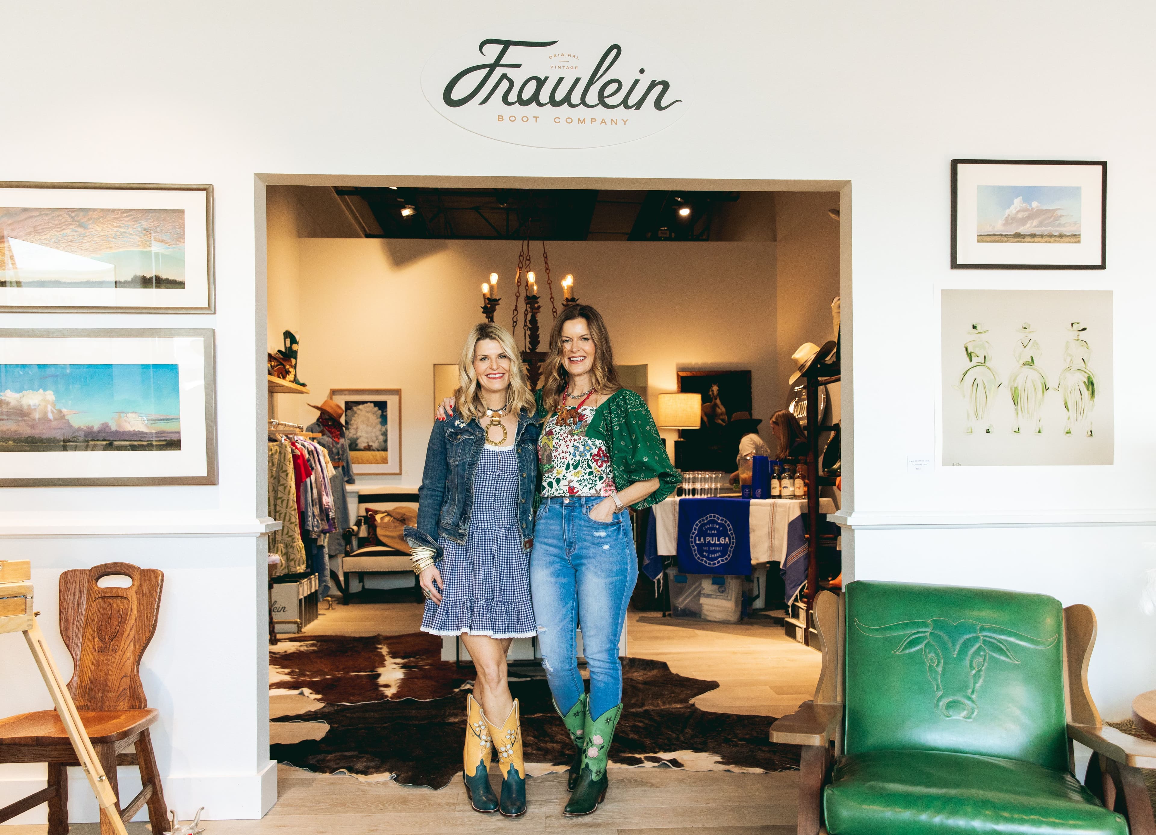 Sisters standing in the doorway of their shop