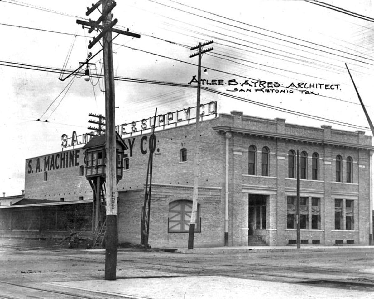 Historic black-and-white photo of the San Antonio Machine and Supply Company building in Texas